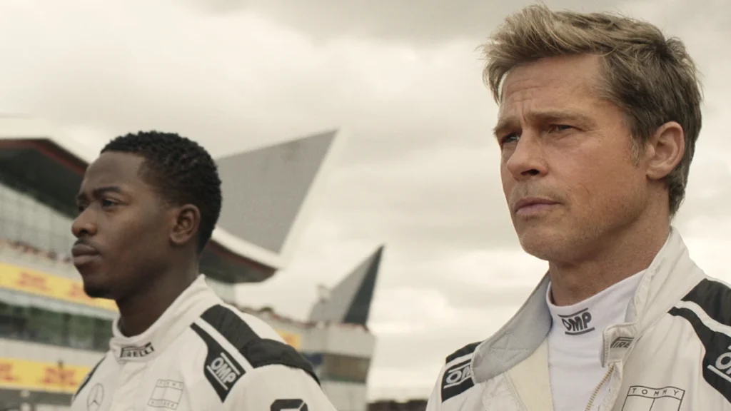 DAMSON IDRIS as Joshua Pearce and BRAD PITT as Sonny Hayes in Apple Original Films’ “F1®,” a Warner Bros. Pictures release.