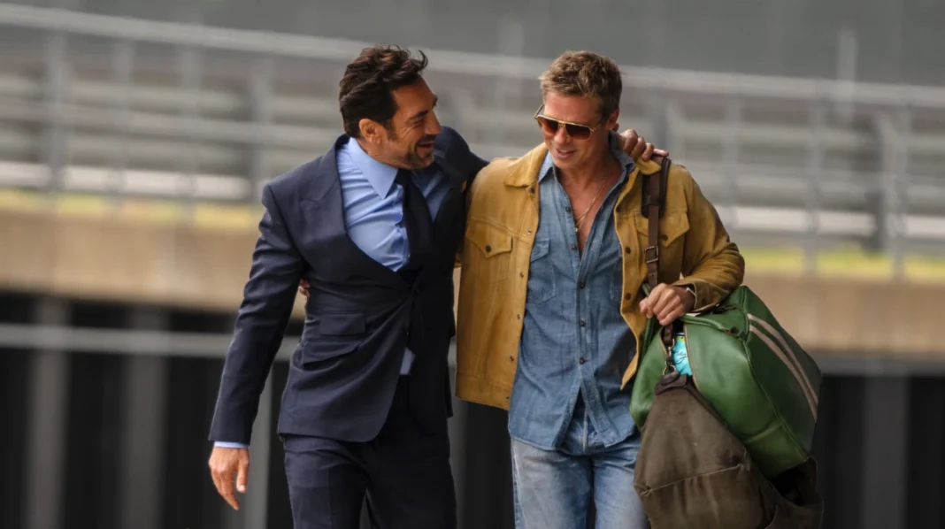 JAVIER BARDEM as Ruben Cervantes and BRAD PITT as Sonny Hayes in Apple Original Films’ “F1®,” a Warner Bros. Pictures release.