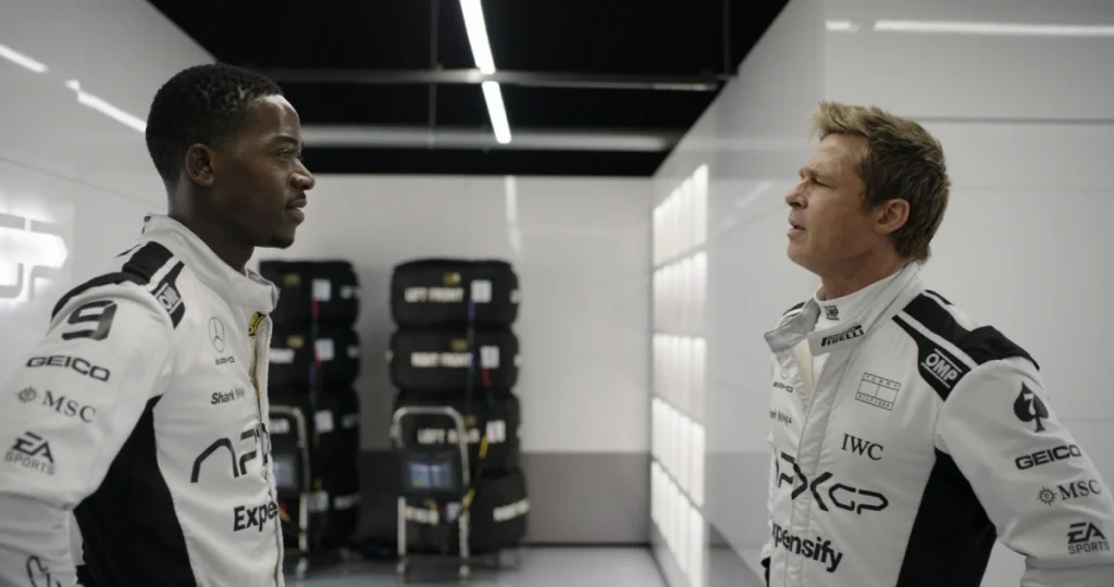 DAMSON IDRIS as Joshua Pearce and BRAD PITT as Sonny Hayes in Apple Original Films’ “F1®,” a Warner Bros. Pictures release.